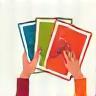 Hands adjusting colorful print samples