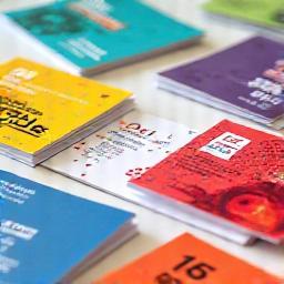 Samples of vibrant printed flyers and business cards